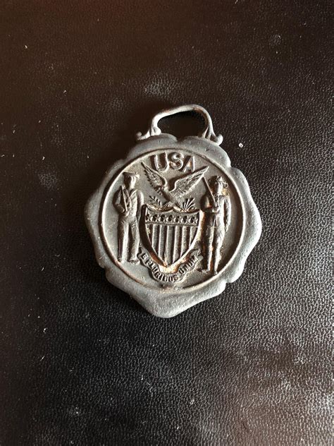 Old US Medal, possibly military, might be made of steel. It  